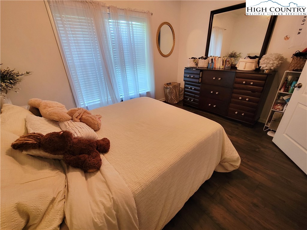 107 Stratford Lane, Unit 24B Boone, NC 28607 - Photo 37 of 45 a bedroom with a bed and cabinets