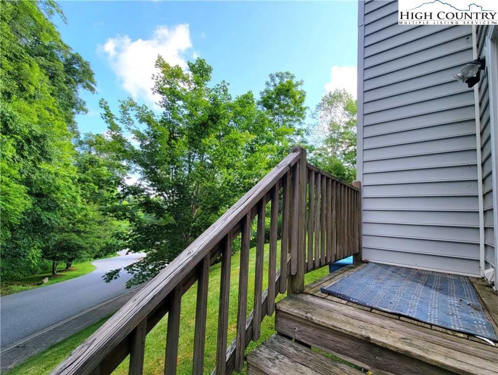 107 Stratford Lane, Unit 24B Boone, NC 28607 - Photo 40 of 45 a view of a house with backyard and wooden stairs