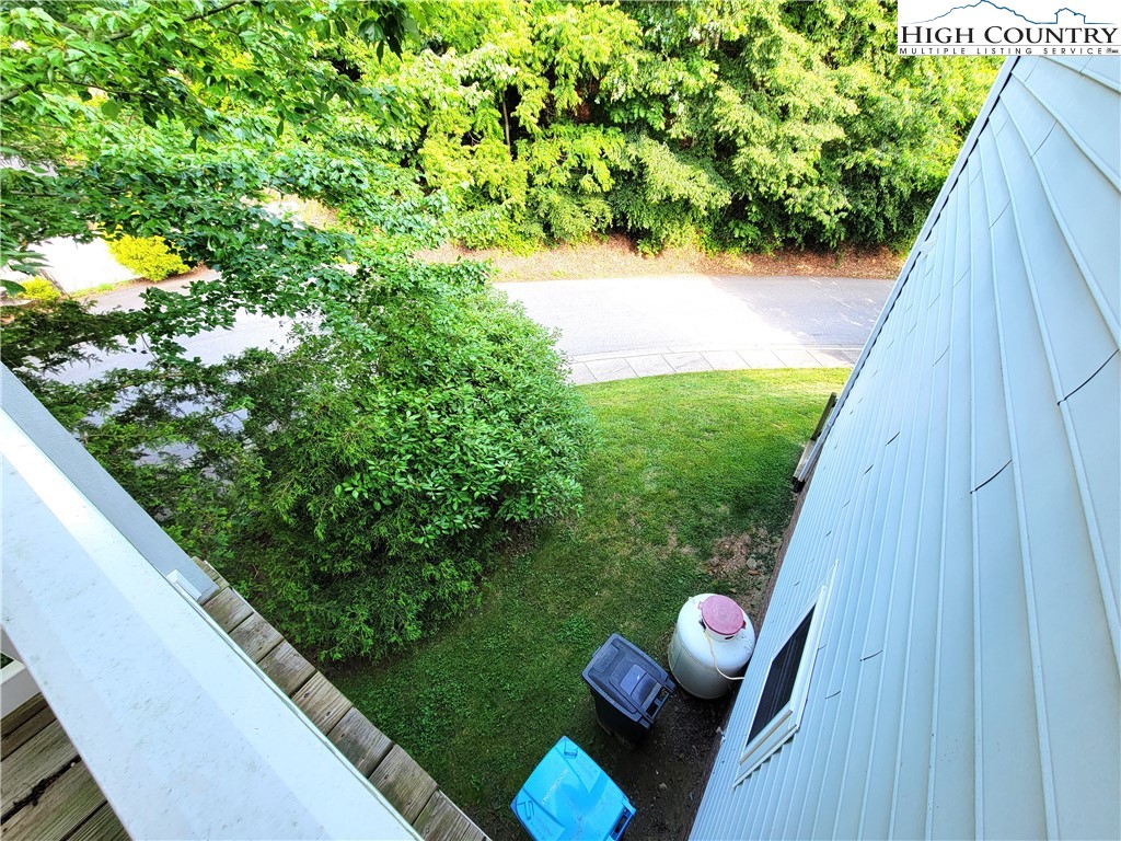 107 Stratford Lane, Unit 24B Boone, NC 28607 - Photo 42 of 45 a view of yard from deck with patio