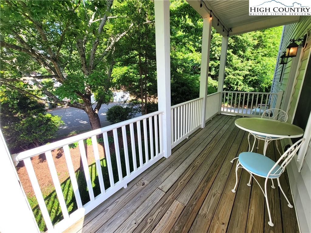 107 Stratford Lane, Unit 24B Boone, NC 28607 - Photo 5 of 45 a view of balcony with wooden floor and outdoor seating