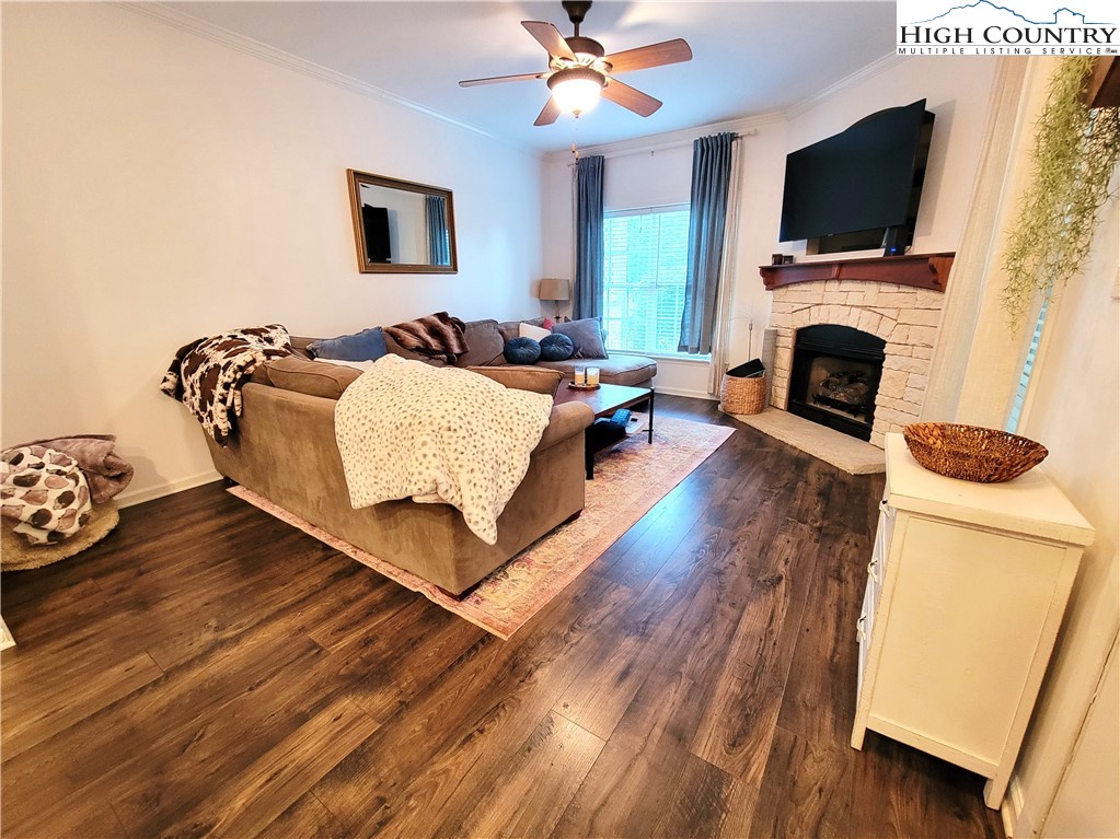 107 Stratford Lane, Unit 24B Boone, NC 28607 - Photo 7 of 45 a living room with furniture fireplace and flat screen tv