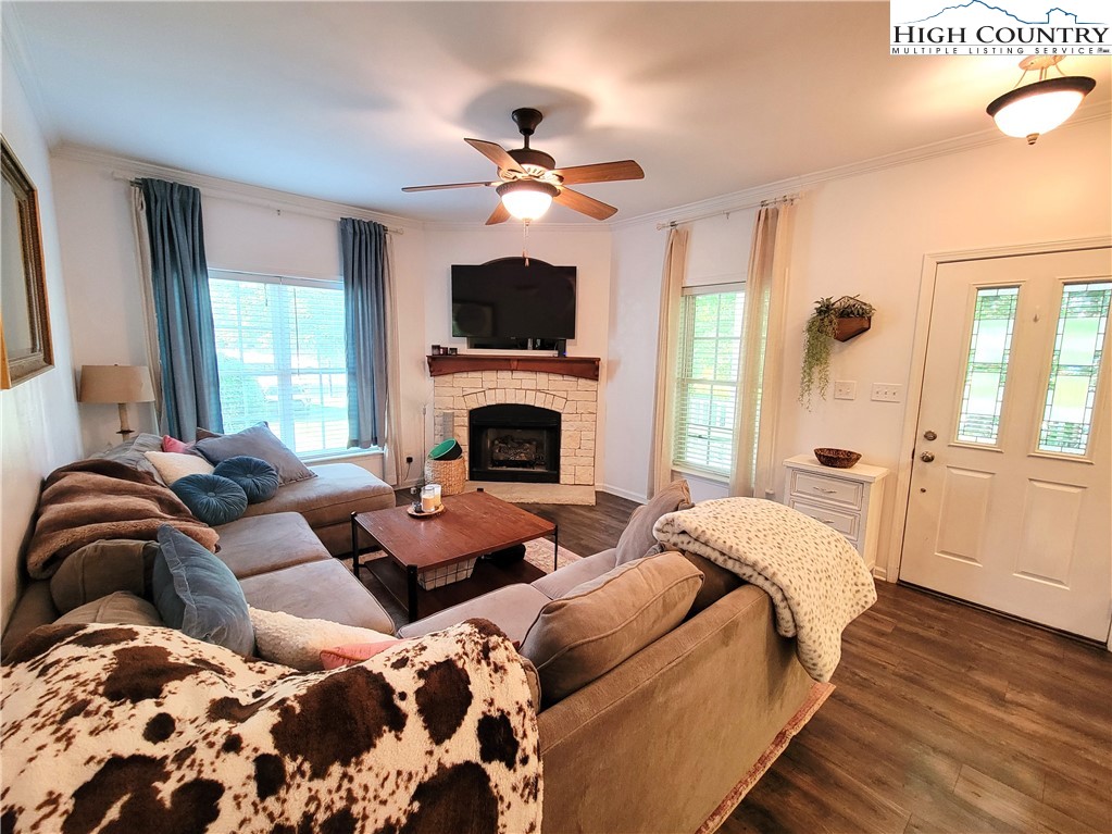 107 Stratford Lane, Unit 24B Boone, NC 28607 - Photo 8 of 45 a bedroom with a large bed and a fireplace