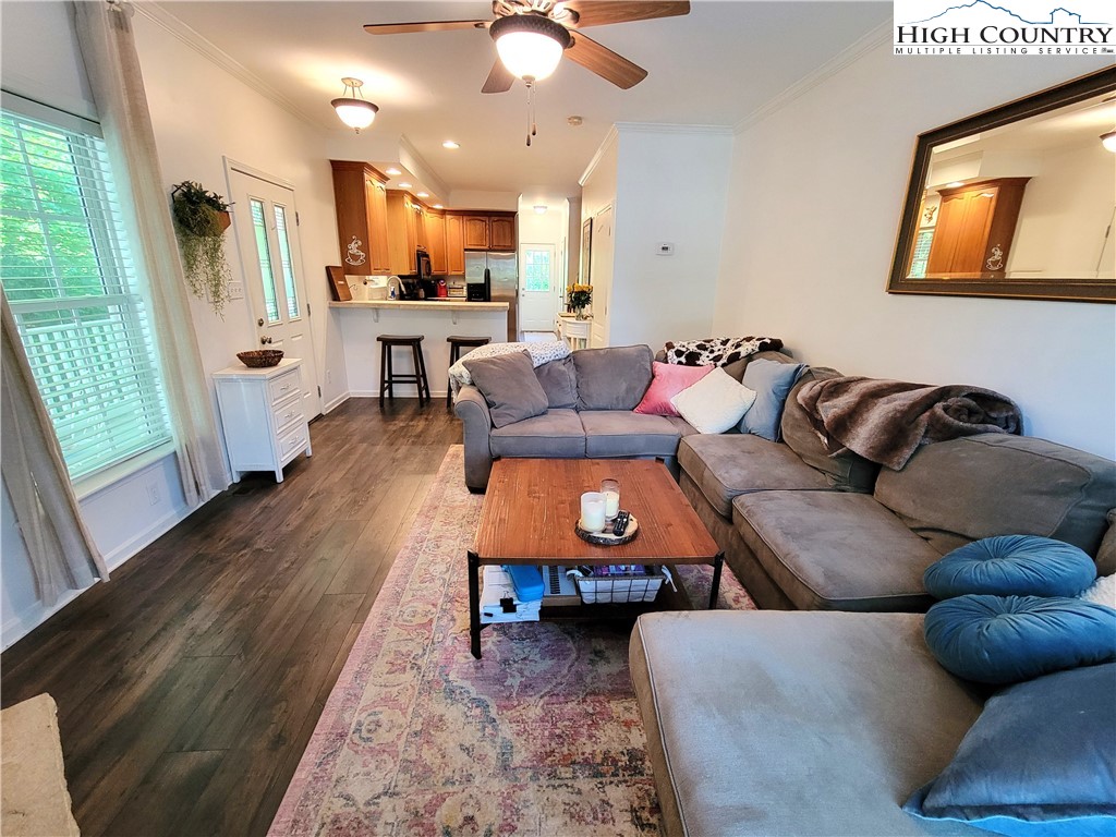 107 Stratford Lane, Unit 24B Boone, NC 28607 - Photo 9 of 45 a living room with furniture and a large window