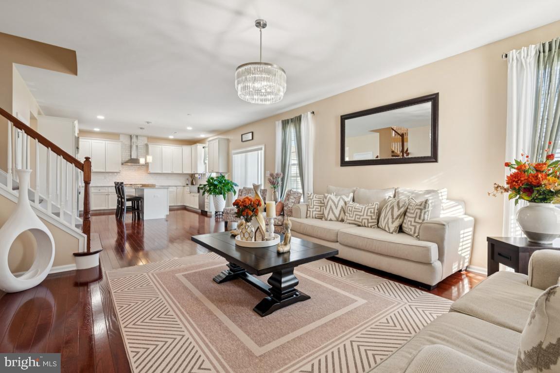 30 Champlain Road Marlton, NJ 08053 - Photo 13 of 30 a living room with furniture a fireplace and a chandelier