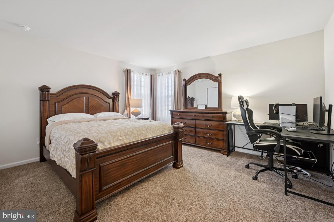 30 Champlain Road Marlton, NJ 08053 - Photo 22 of 30 a bedroom with a bed and a desk