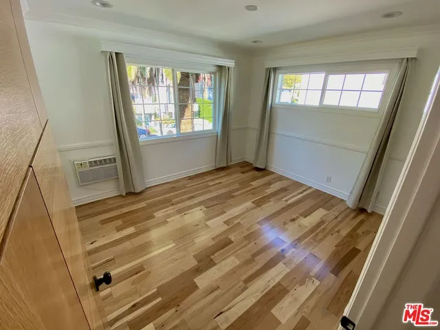 a view of empty room with windows