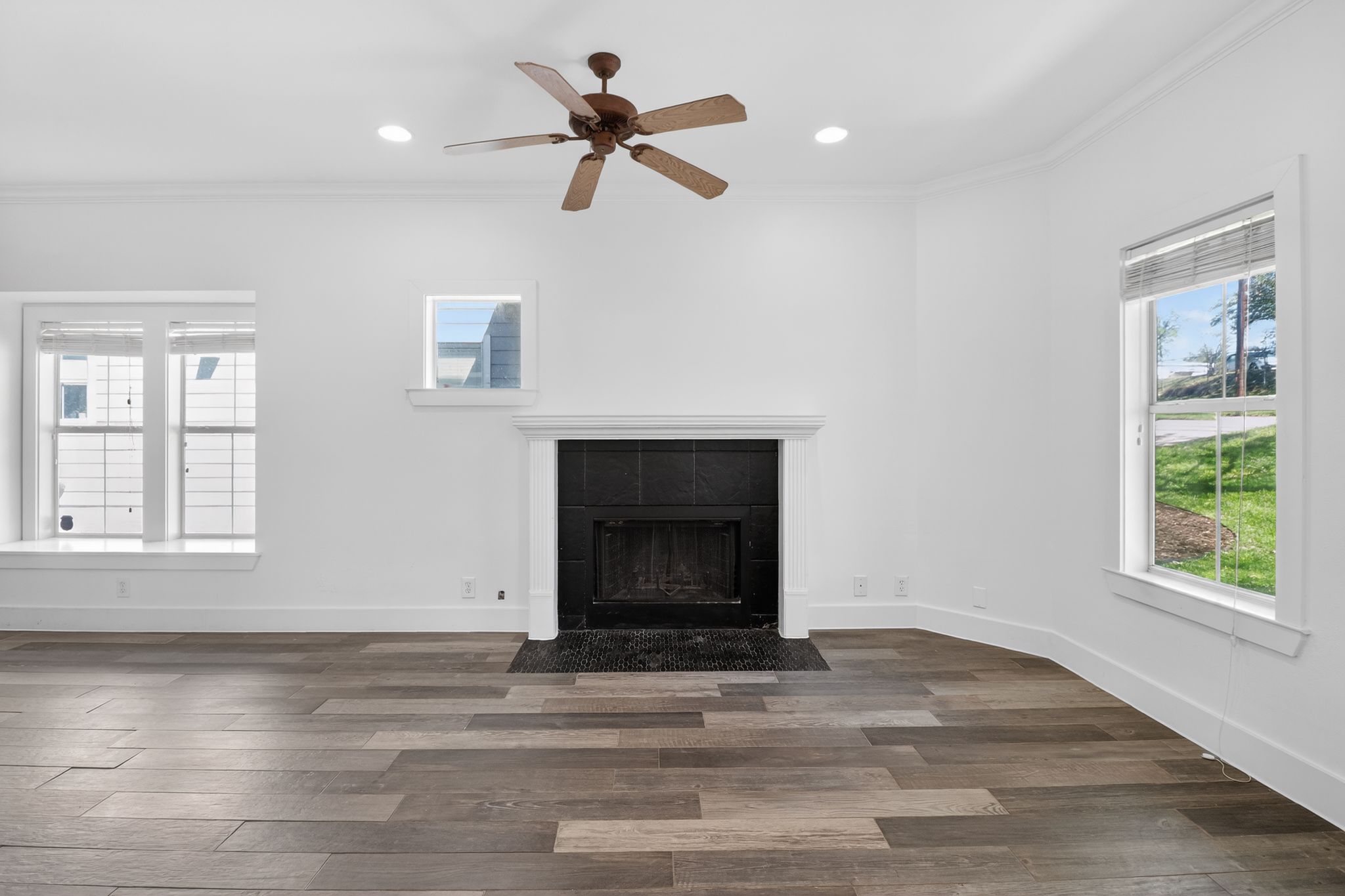 3614 South 2nd Street Austin, TX 78704 - Photo 4 of 40 a view of an empty room with wooden floor fireplace and a window
