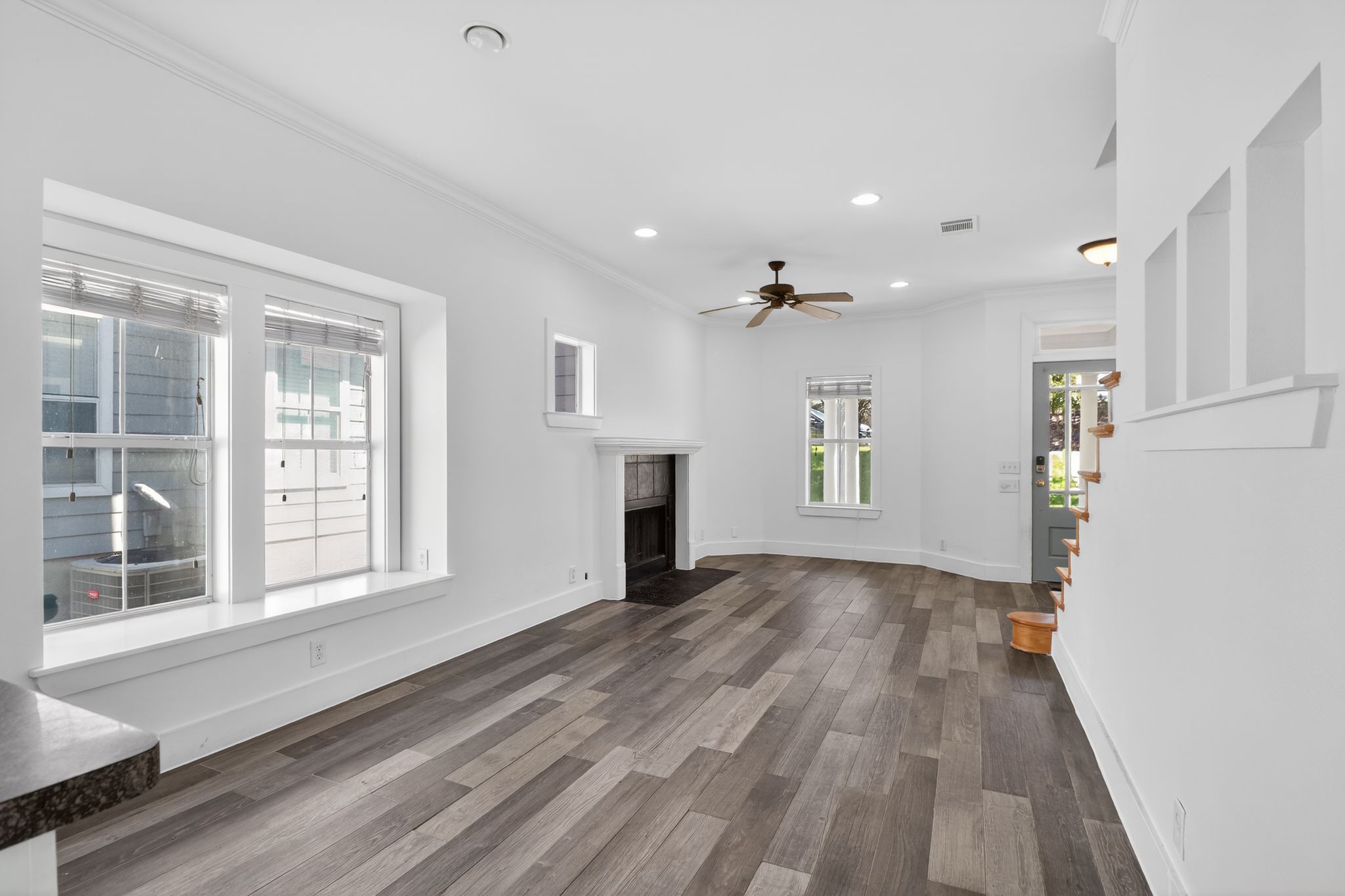 3614 South 2nd Street Austin, TX 78704 - Photo 5 of 40 a view of empty room with wooden floor and fireplace
