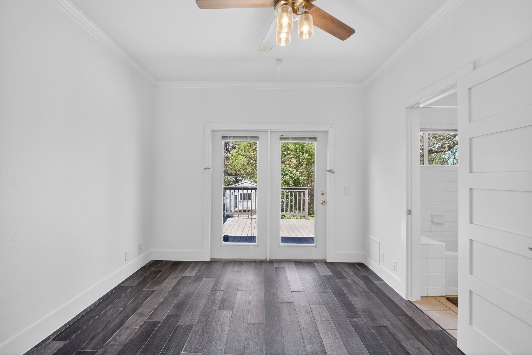 3614 South 2nd Street Austin, TX 78704 - Photo 9 of 40 an empty room with wooden floor and windows