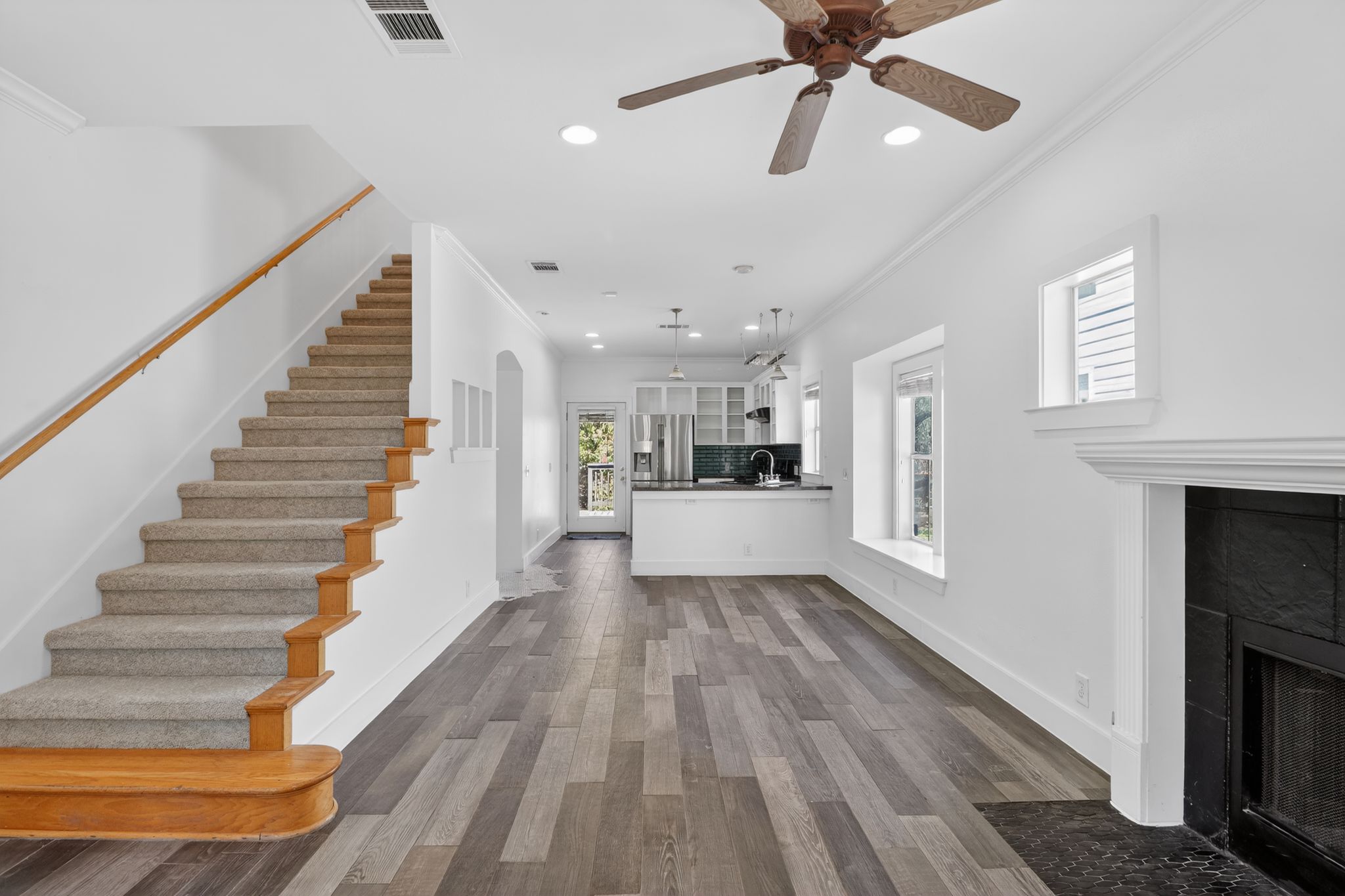 3614 South 2nd Street Austin, TX 78704 - Photo 10 of 40 a view of a hallway with wooden floor and a kitchen