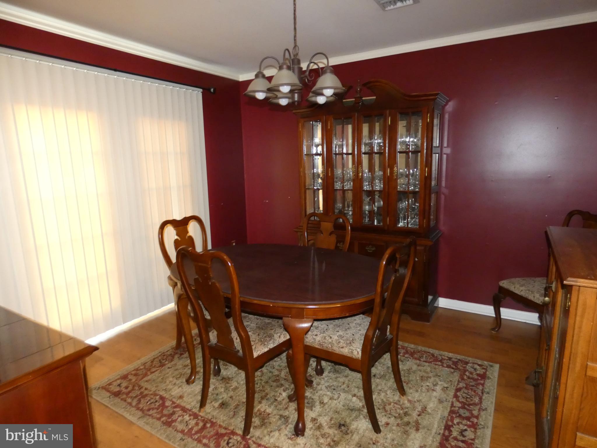 69-3 Azalea Way Reading, PA 19606 - Photo 7 of 16 Elegant dining space with rich burgundy walls.