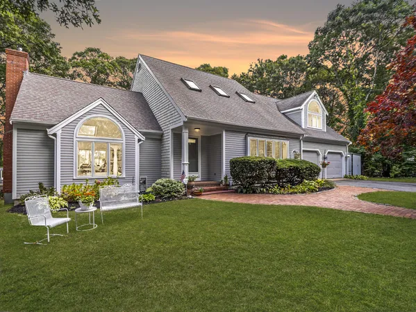 a front view of a house with garden