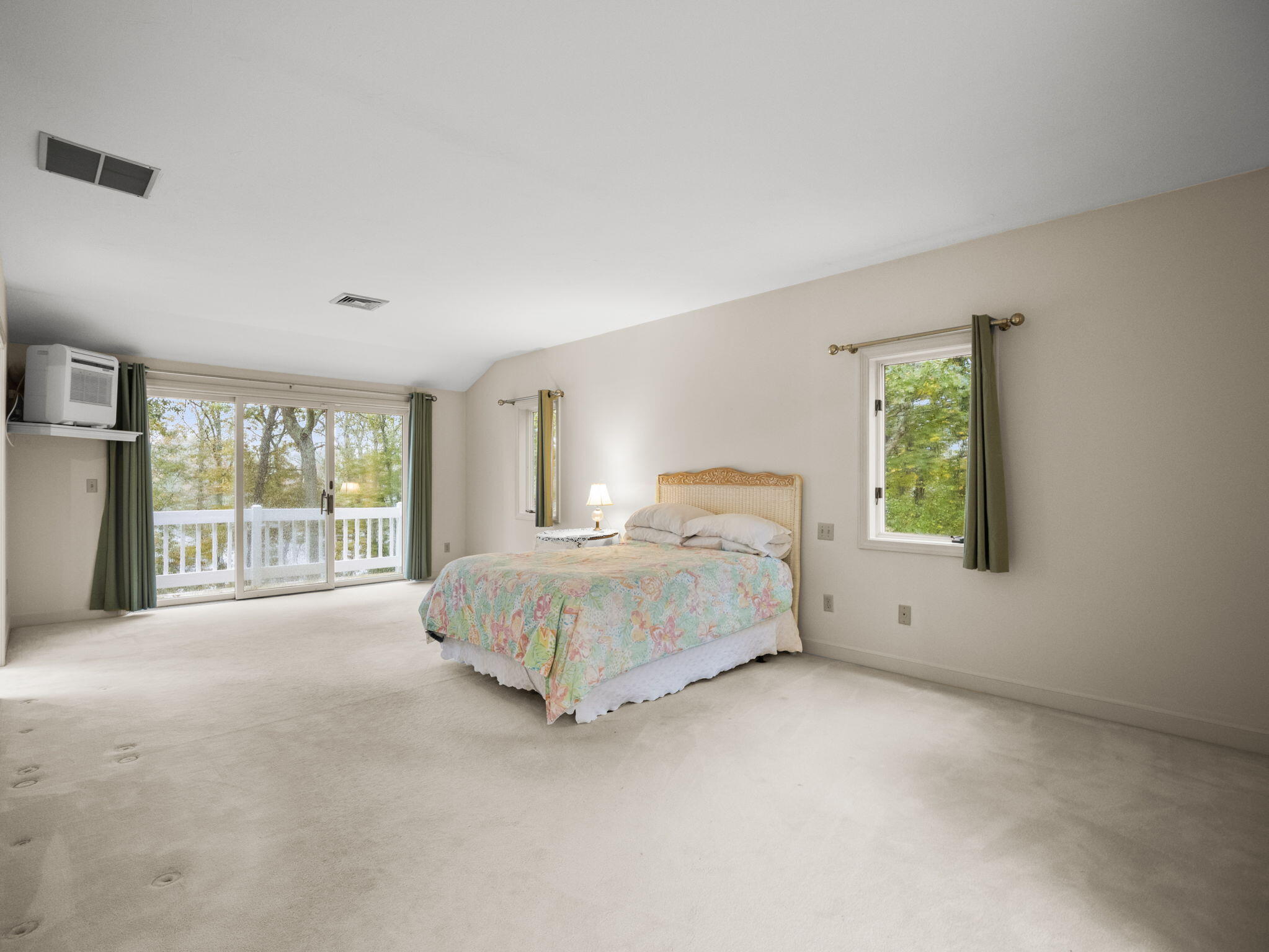 15 Goldie Way Barnstable, MA 02601 - Photo 34 of 48 a spacious bedroom with a bed and a large window