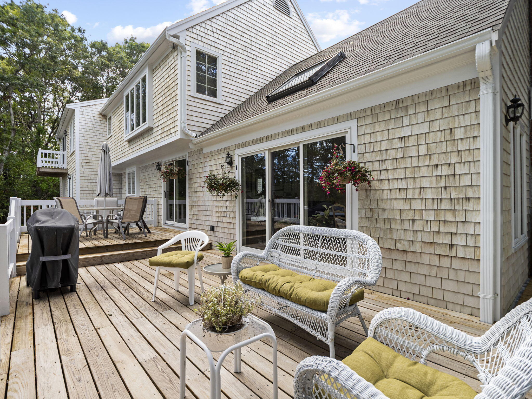15 Goldie Way Barnstable, MA 02601 - Photo 8 of 48 a view of a patio with couches chairs and wooden floor