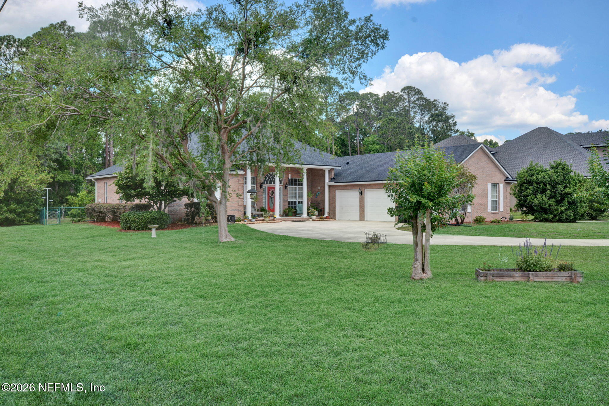 5950 West Shores Road Orange Park, FL 32003 - Photo 25 of 42 a house view with a garden space