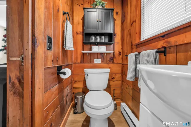 a bathroom with a toilet and a sink