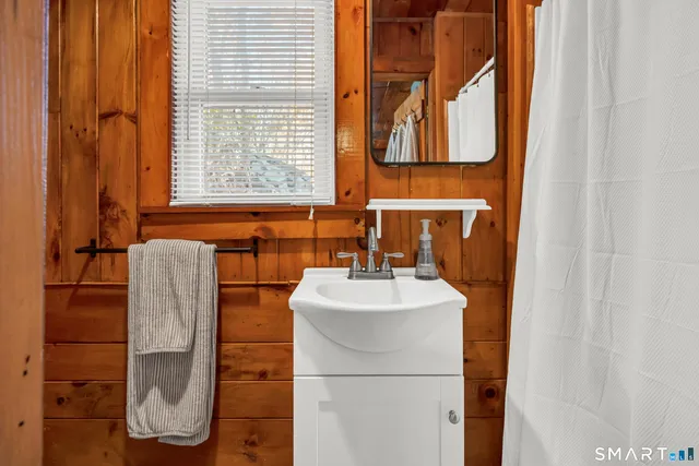 a bathroom with a sink and mirror