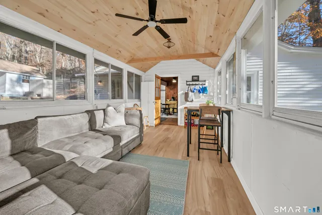 a living room with furniture and a large window