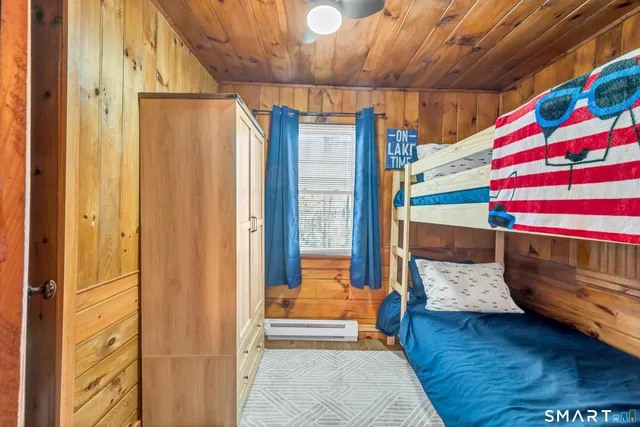 a bedroom with a bed and a mirror