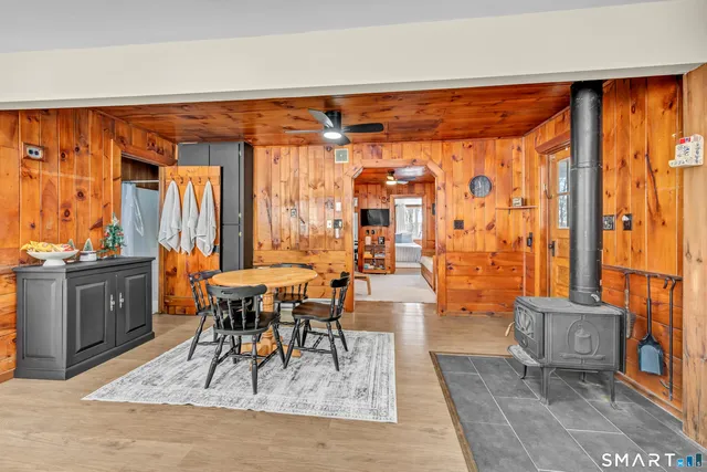 a living room with furniture a rug and a window