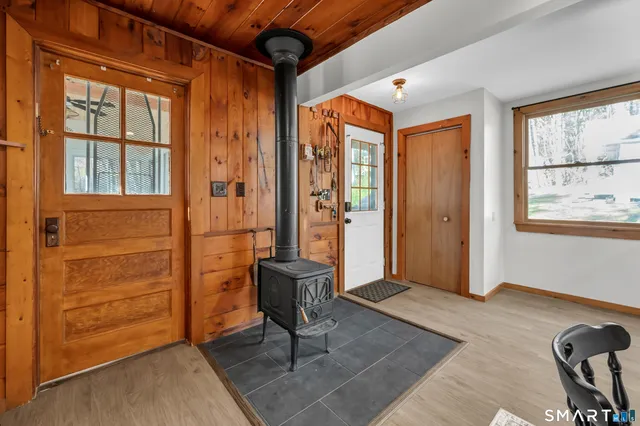 a view of an entryway with wooden floor and windows