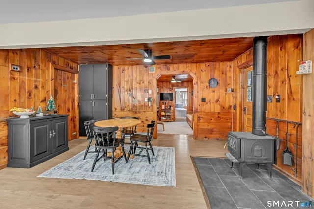 a dining room with furniture and a rug