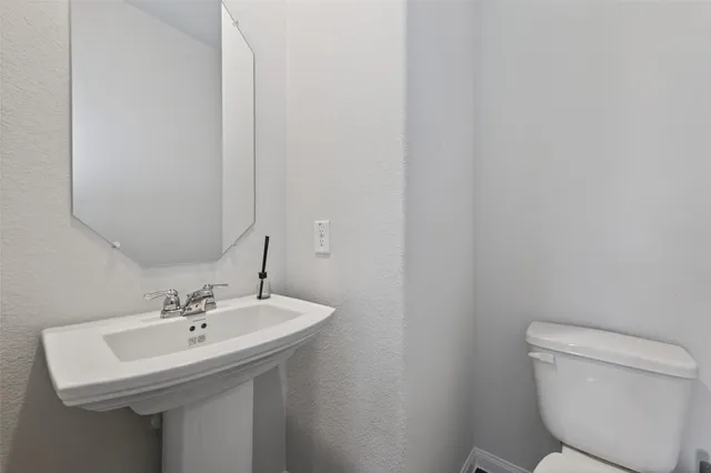 a sink and a toilet in a bathroom