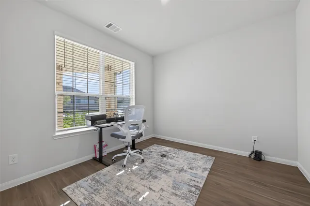 a work room with a window and a table