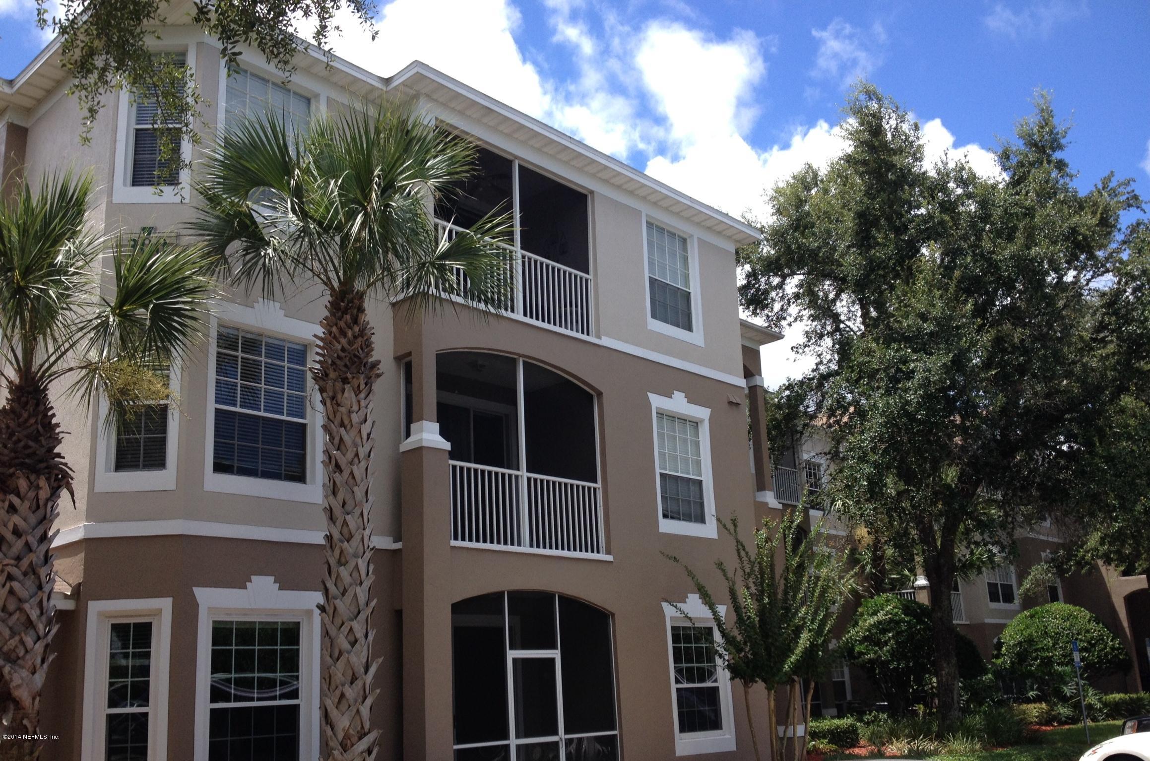 a front view of a house with tree s