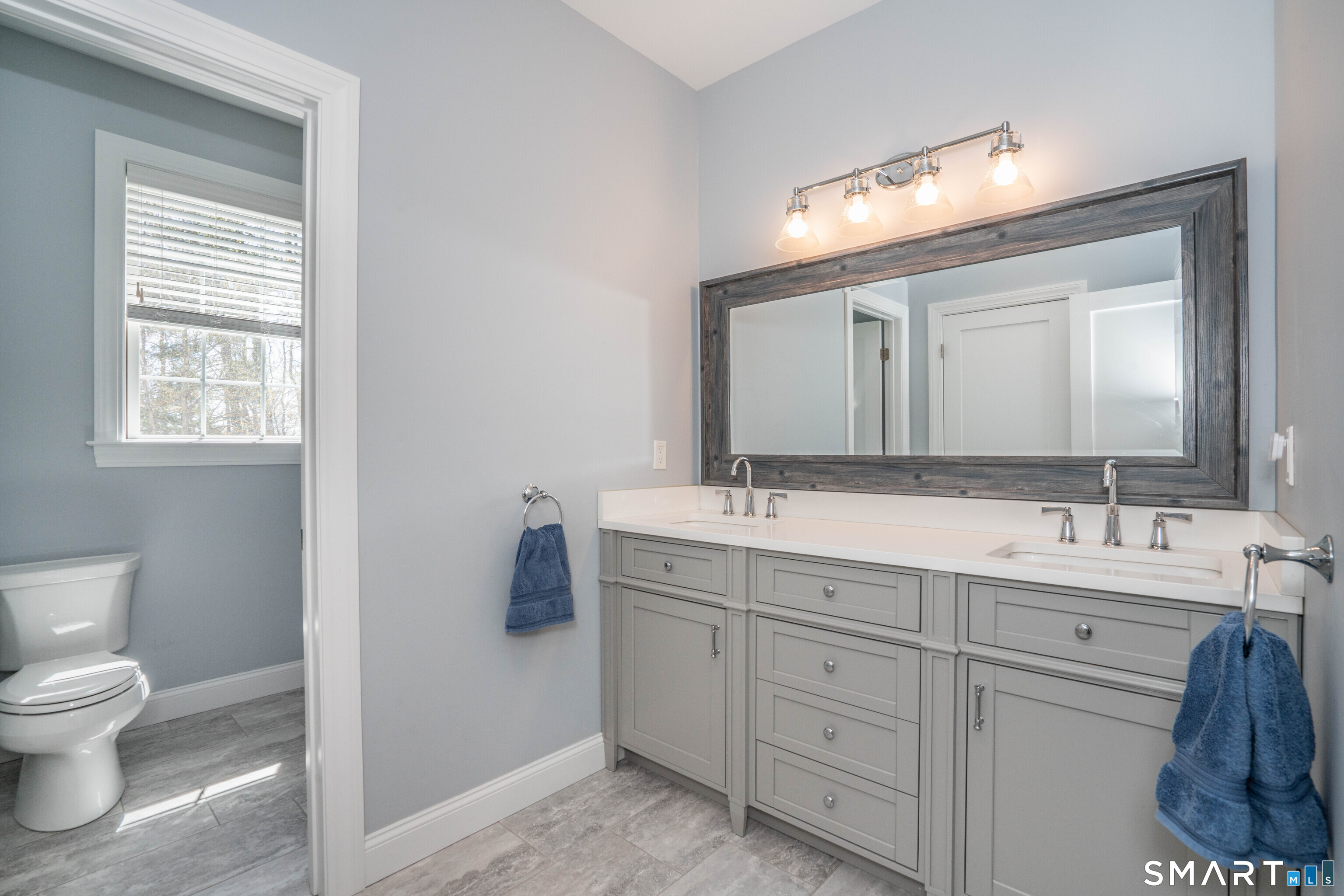 152 Old Farms Road Simsbury, CT 06070 - Photo 26 of 40 Hall Bathroom with double vanity and water closet for the toilet and shower for privacy