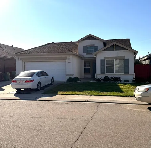 a view of a car parked in front of a house