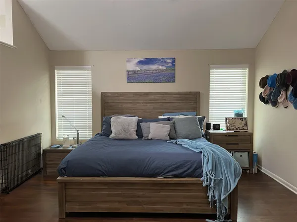 a bedroom with a bed and window