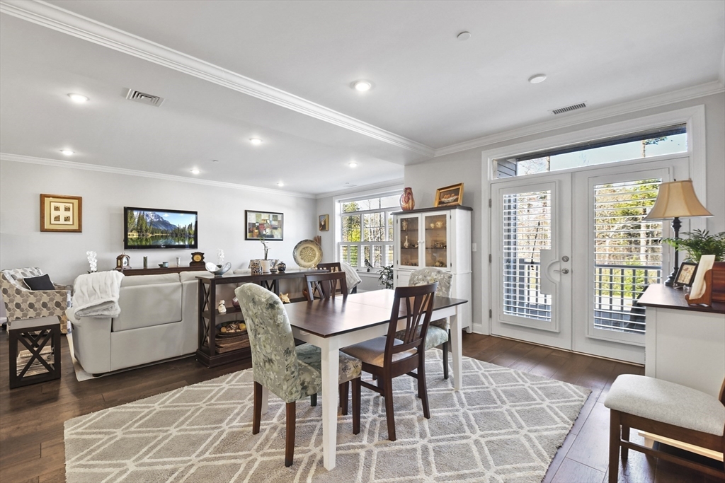 635 Old Post Road, Unit 108 Sharon, MA 02067 - Photo 12 of 42 a view of a dining room with furniture