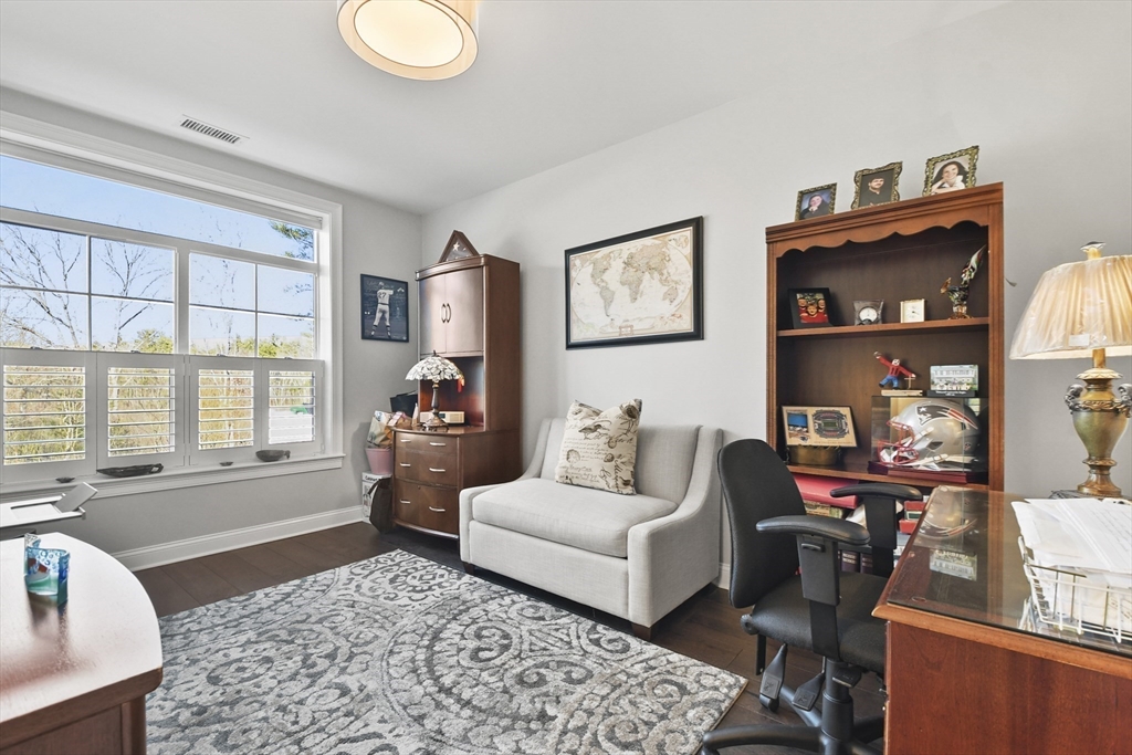 635 Old Post Road, Unit 108 Sharon, MA 02067 - Photo 16 of 42 a living room with furniture and a window