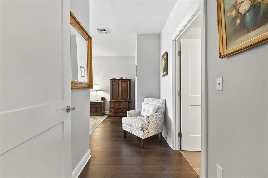 635 Old Post Road, Unit 108 Sharon, MA 02067 - Photo 21 of 42 a view of living room with furniture and wooden floor