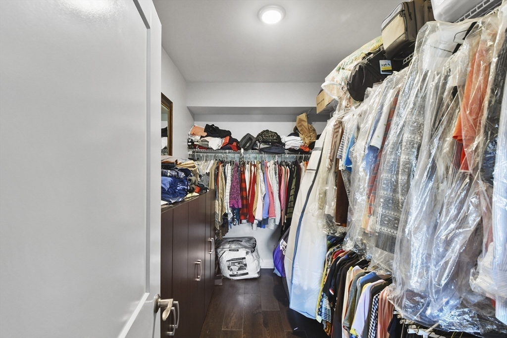 635 Old Post Road, Unit 108 Sharon, MA 02067 - Photo 28 of 42 a view of walk in closet with clothes
