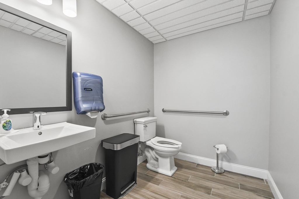 635 Old Post Road, Unit 108 Sharon, MA 02067 - Photo 35 of 42 a bathroom with a sink and a toilet