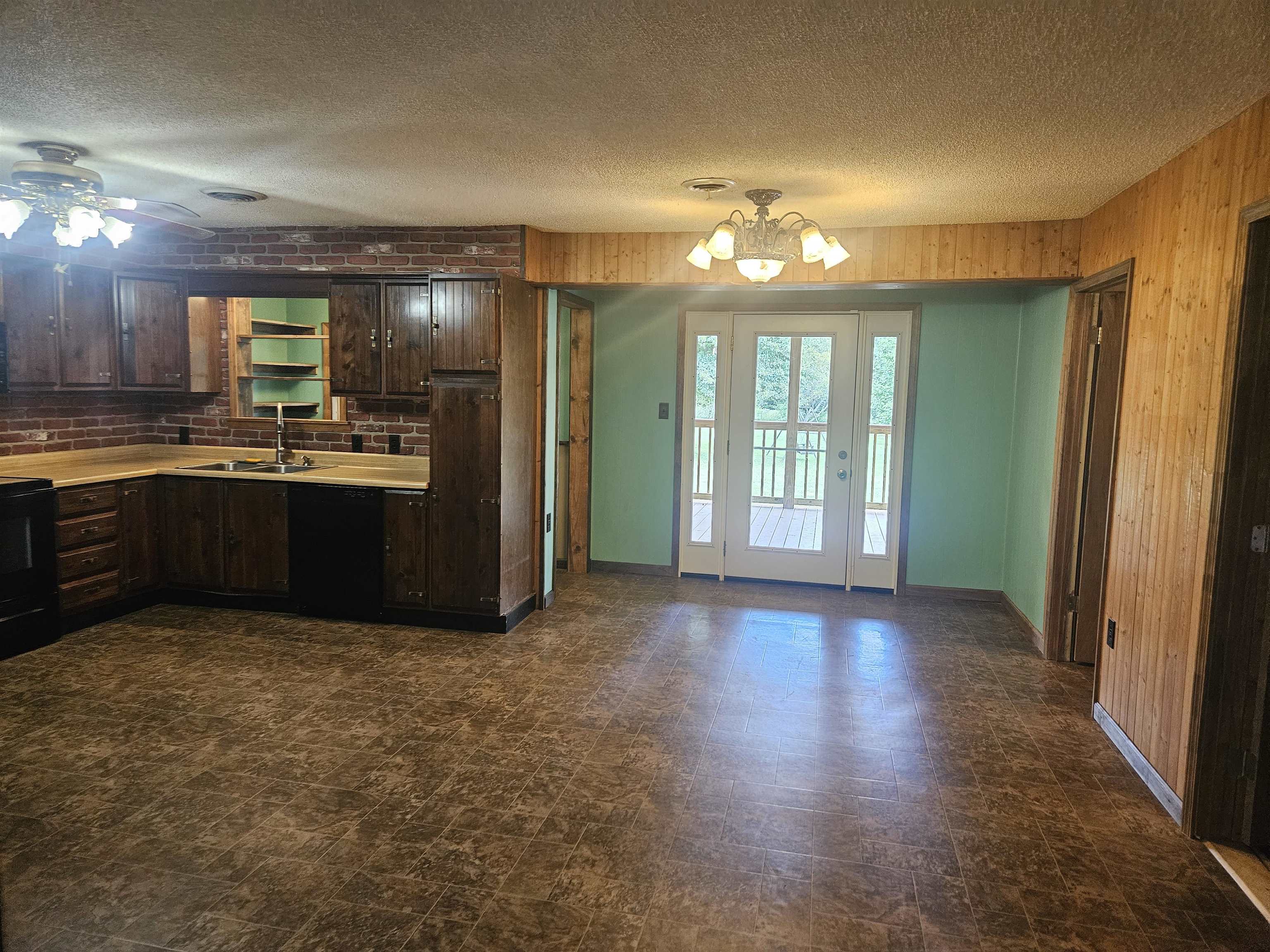 272 Brammer Road Covington, TN 38019 - Photo 5 of 31 a view of a kitchen with granite countertop a refrigerator and a sink