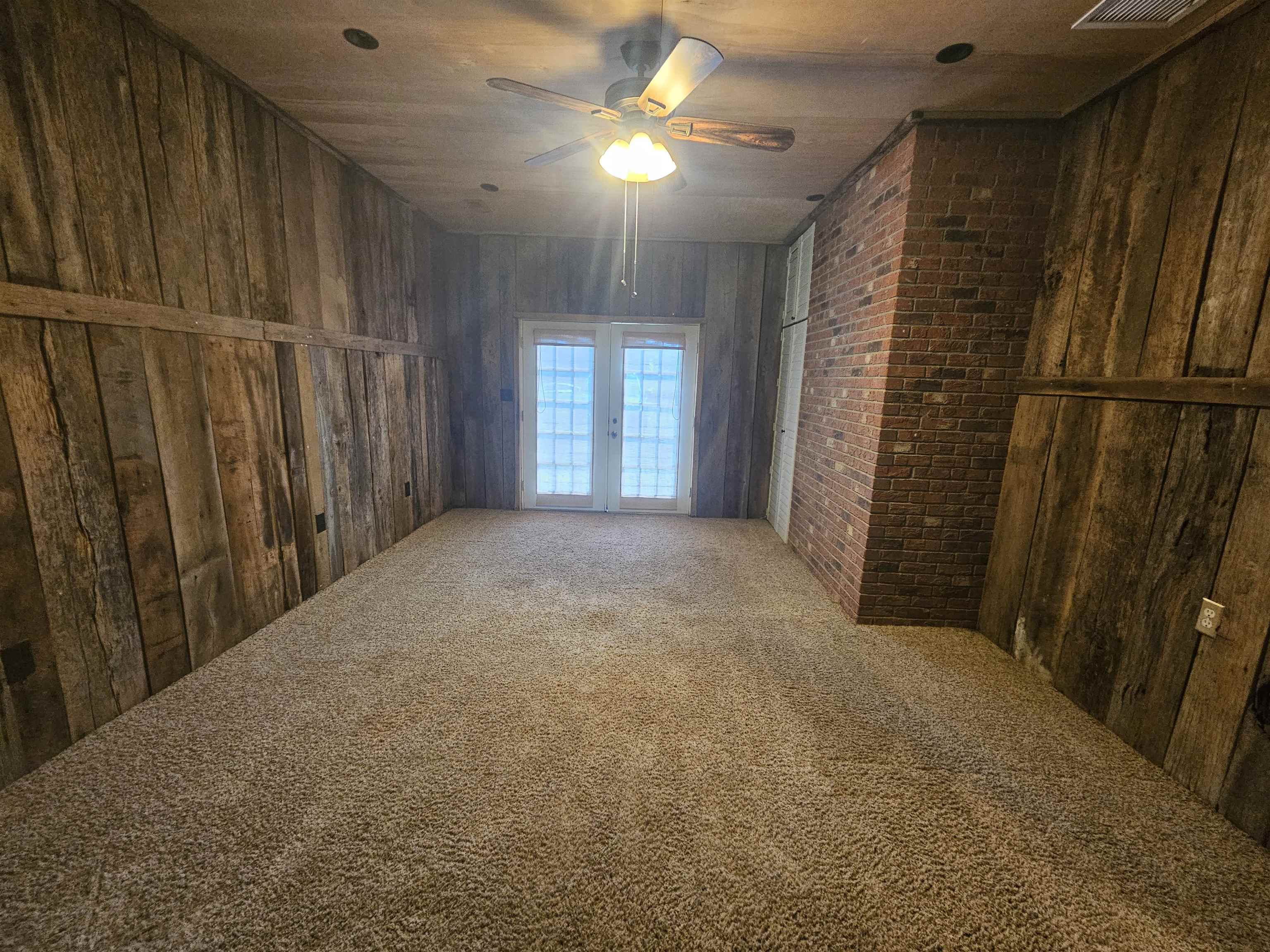 272 Brammer Road Covington, TN 38019 - Photo 8 of 31 a view of a hallway with closet and chandelier fan