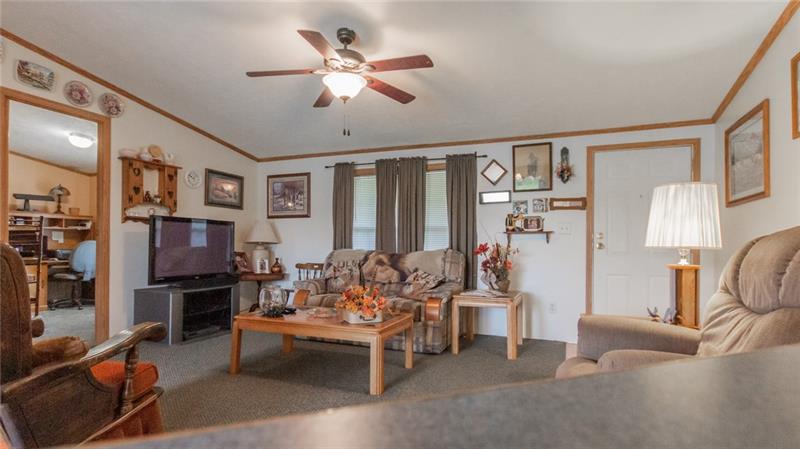 285 Cole Road Sandy Lake, PA 16145 - Photo 4 of 25 Living room into bedroom #3