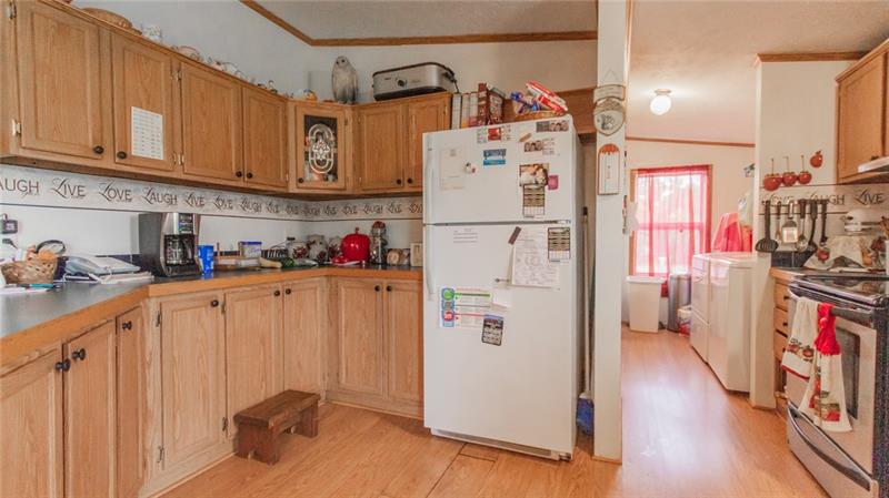 285 Cole Road Sandy Lake, PA 16145 - Photo 7 of 25 Kitchen into main floor laundry!