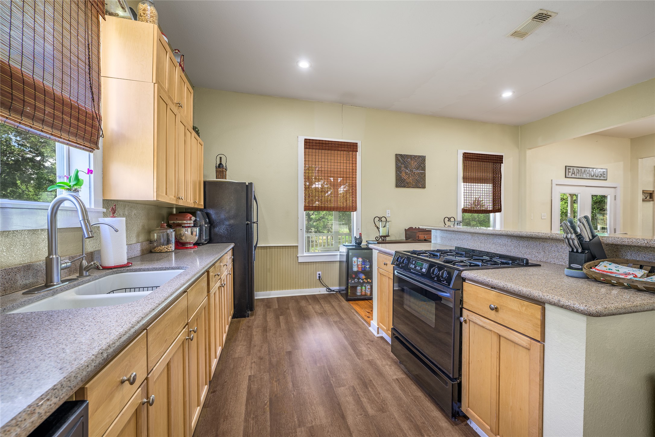4310 Leslie Road Fayetteville, TX 78940 - Photo 7 of 22 a kitchen with stainless steel appliances granite countertop a stove and a sink