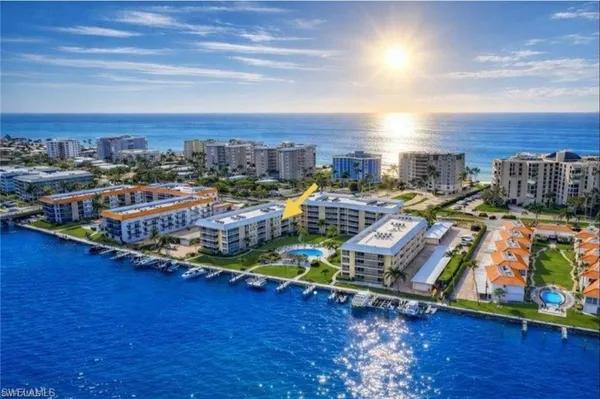 a large kitchen with stainless steel appliances lots of counter space and a sink