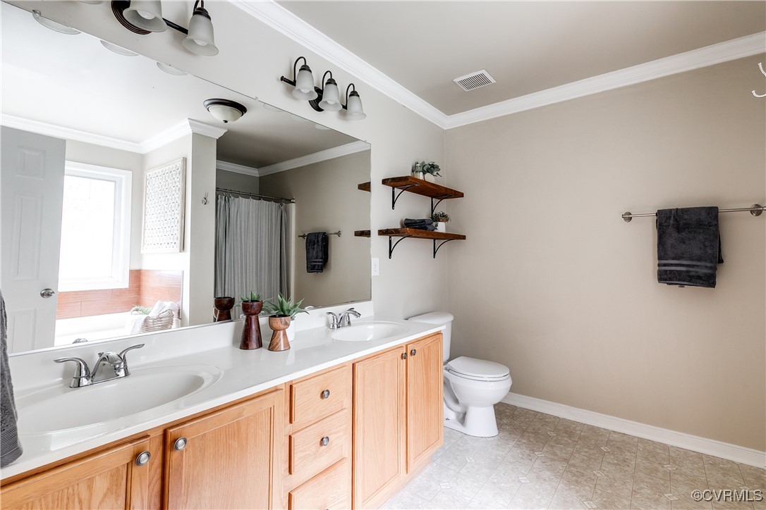 11201 Danforth Road Chesterfield, VA 23838 - Photo 19 of 31 a bathroom with a granite countertop sink mirror and toilet