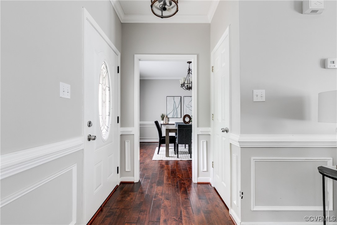 11201 Danforth Road Chesterfield, VA 23838 - Photo 2 of 31 a view of dining room with wooden floor and a hallway