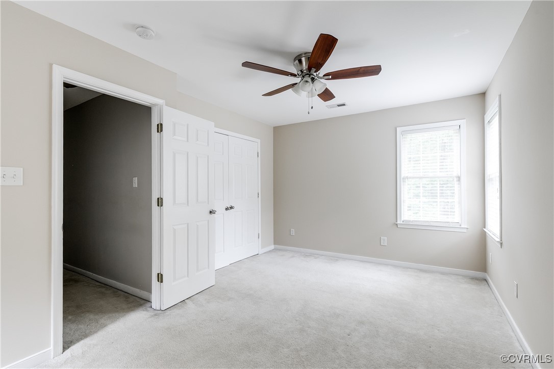 11201 Danforth Road Chesterfield, VA 23838 - Photo 23 of 31 a view of a livingroom with a ceiling fan and window