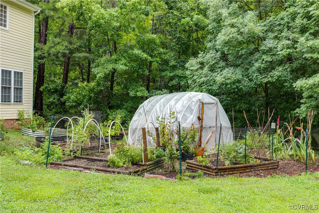 11201 Danforth Road Chesterfield, VA 23838 - Photo 30 of 31 a view of a backyard with a fountain and plants