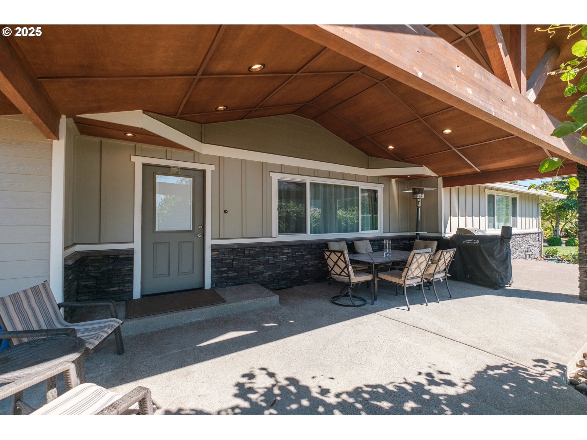 2225 Molalla Road Woodburn, OR 97071 - Photo 20 of 48 a view of a patio with table and chairs with wooden floor