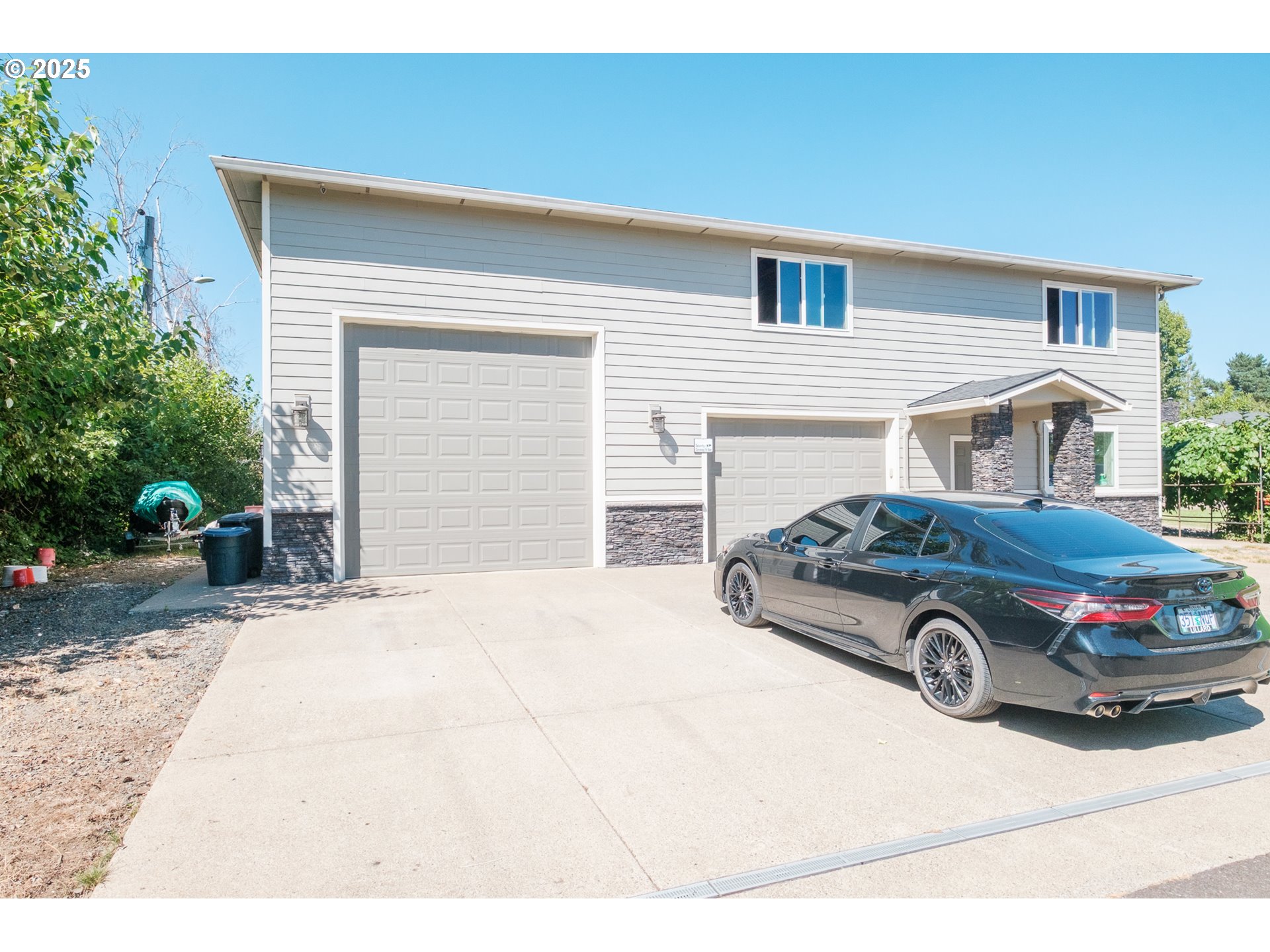 2225 Molalla Road Woodburn, OR 97071 - Photo 2 of 48 a car parked in front of white house
