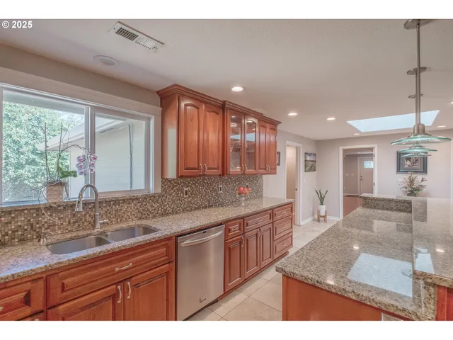 a large bathroom with double vanity and a mirror